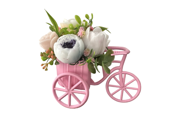 Pink decorative tricycle with white floral arrangement