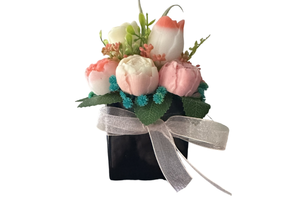 Pink and white floral arrangement with ribbon