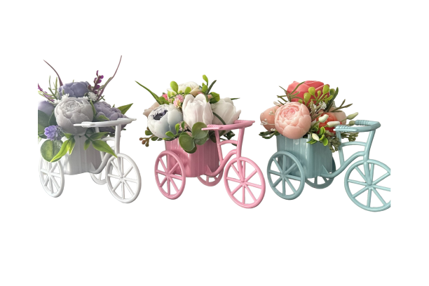 Three pastel tricycle floral arrangements