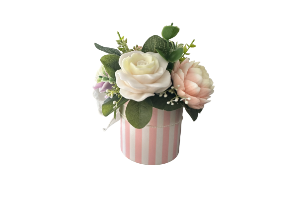Pink striped pot with white and peach flowers