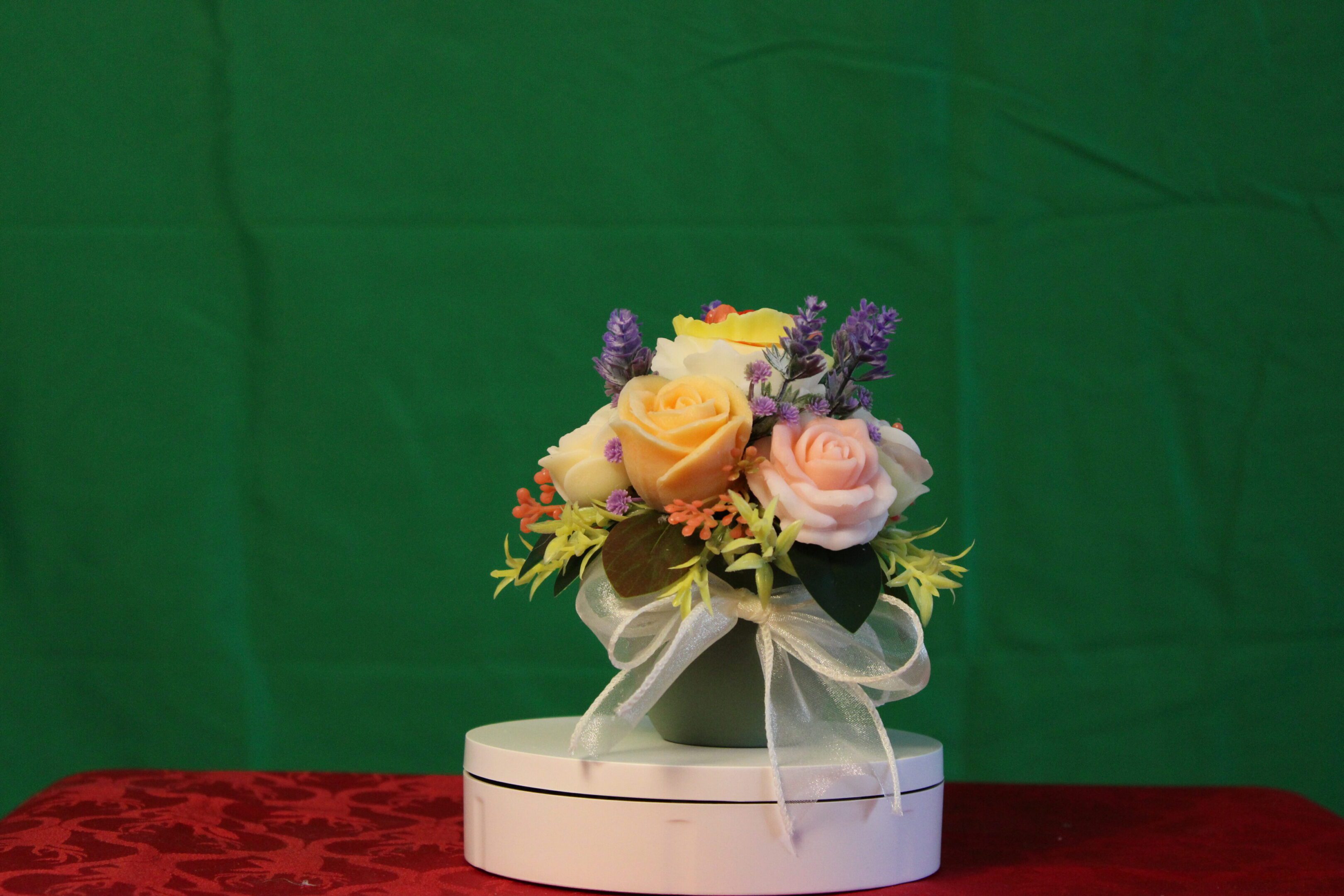 Pastel rose bouquet with ribbon on box