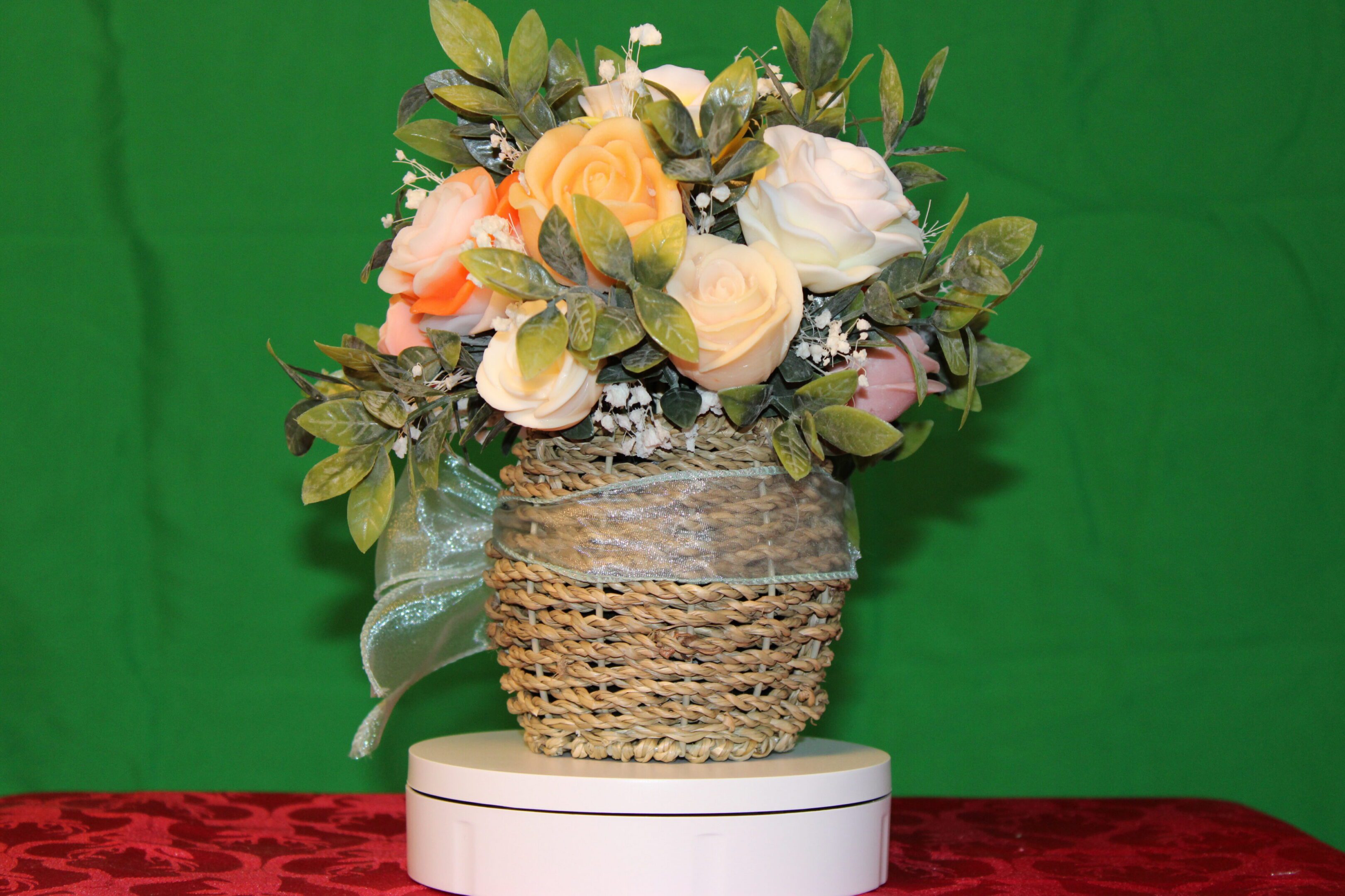 Wicker basket of pastel roses and foliage