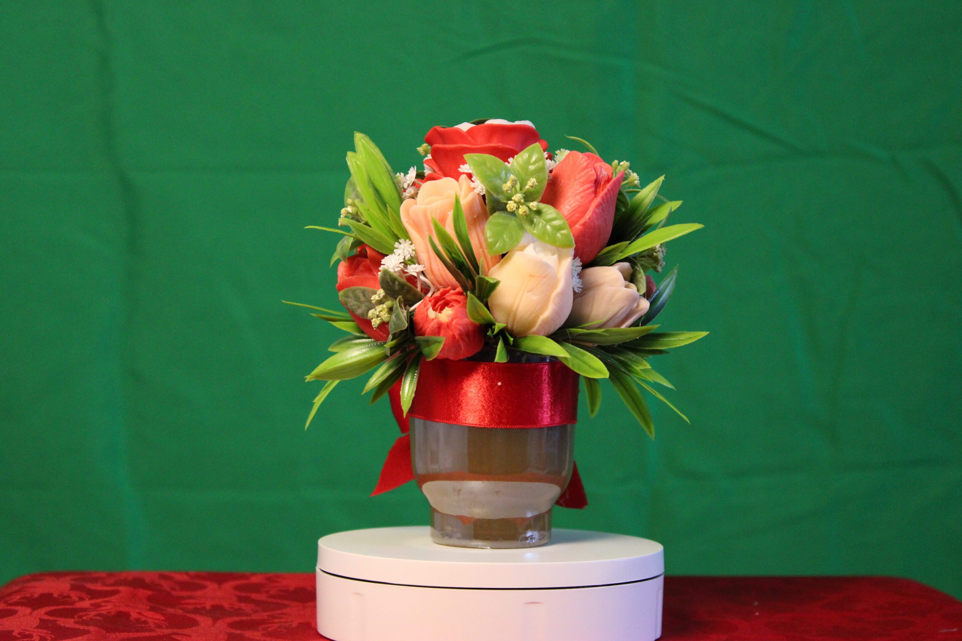 Red and peach tulip bouquet in vase