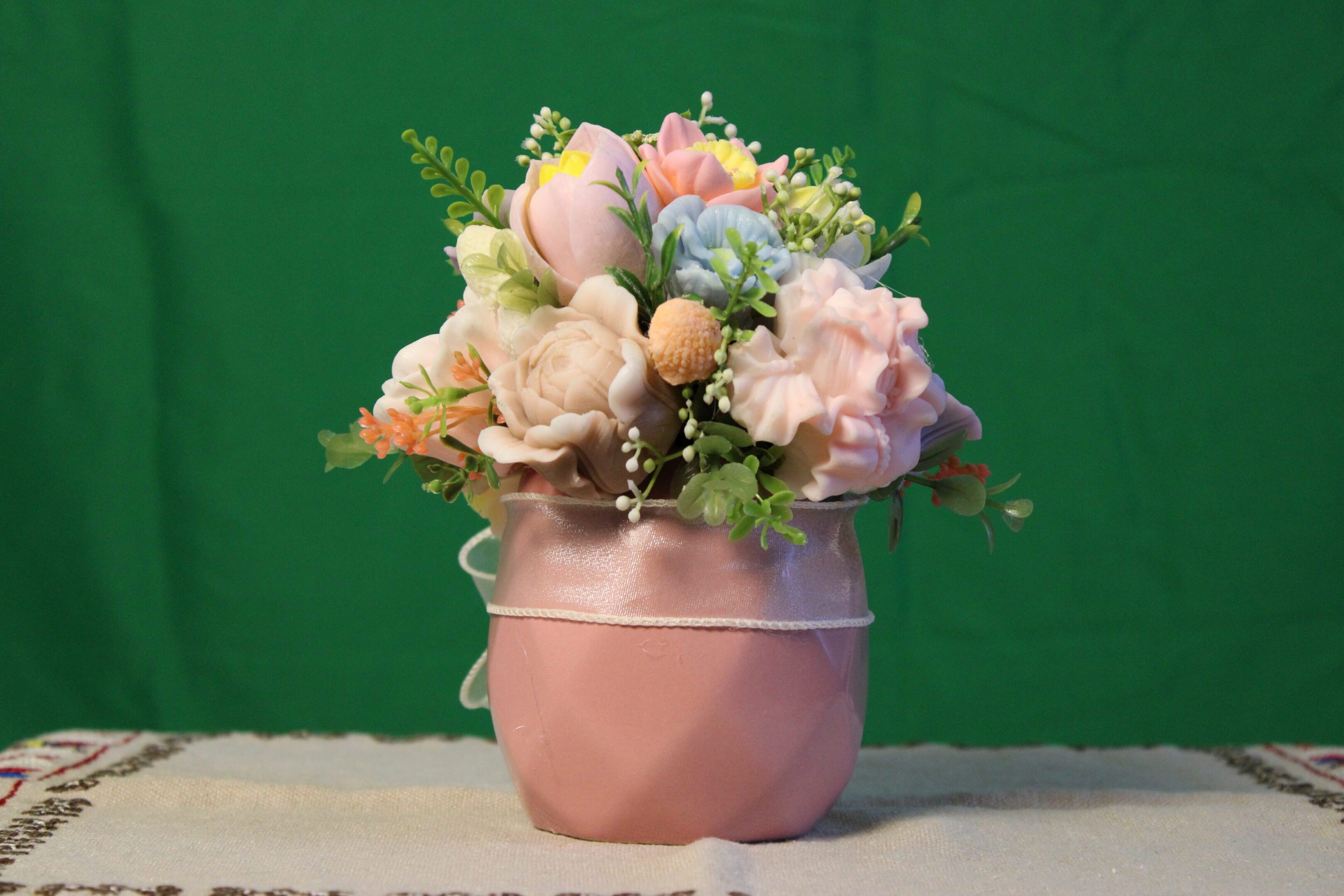 Pastel floral arrangement in pink vase