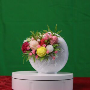 White round vase with colorful floral arrangement